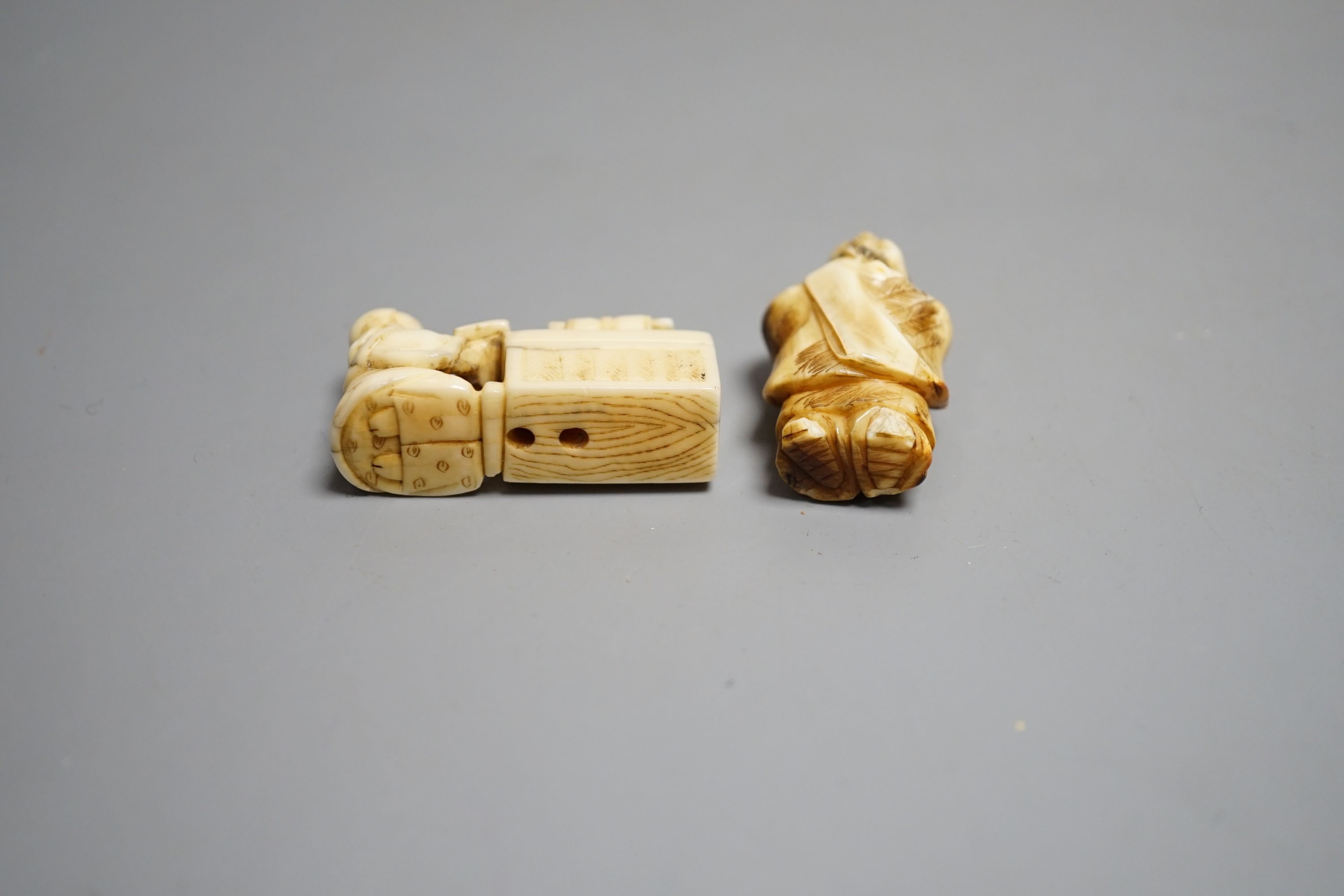 A Japanese ivory netsuke of a man reading a book, a small okimono of Guanyin and monkeys, a Manju netsuke of masks and an early 20th century netsuke of a bearded man